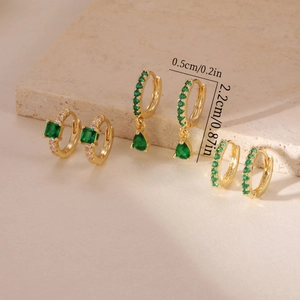 Detailed view of gold plated hoop earrings set with green cubic zirconia and dimensions