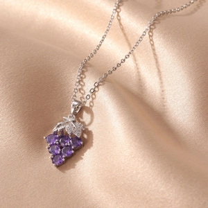 Elegant silver chain necklace with a purple crystal grape cluster and zircon leaf pendant