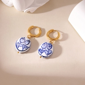Vintage blue and white porcelain tulip drop earrings with elegant golden metal hoops