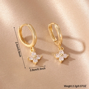 Detail showing 14k gold plated flower hoop earrings with dimensions 2.4cm by 0.8cm