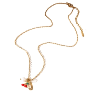 Gold stainless steel necklace with red cherry, letter J, and pearl charms on white base