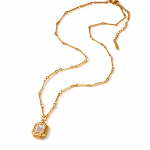 18k gold plated stainless steel necklace with rectangular zircon angel pendant on white base