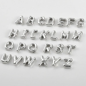 Detail of 26 3D puffed alphabet letter beads in silver finish for DIY jewelry making