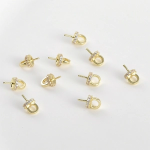 Macro detail of 14k gold plated ring bail with cubic zirconia stones for DIY jewelry