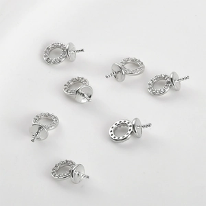 Macro view of 14k gold plated pearl cup bails with zircon stones for jewelry making