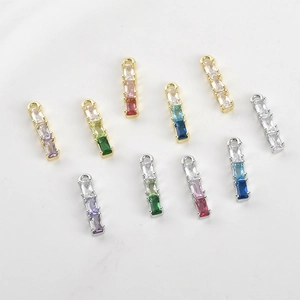 Detailed view of colorful baguette-cut gemstone pendants for jewelry making