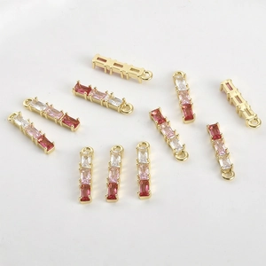 Close-up of 14k gold-plated bamboo pendants with gradient pink zircon for jewelry making