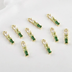 Detail of 8 gold-plated bamboo pendants with gradient white and green cubic zirconia