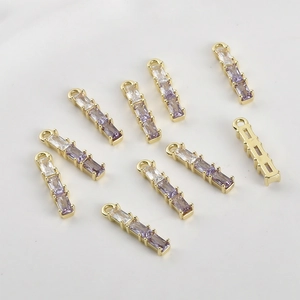 Detail of 14k gold plated bamboo pendant with purple gradient cubic zirconia for DIY jewelry