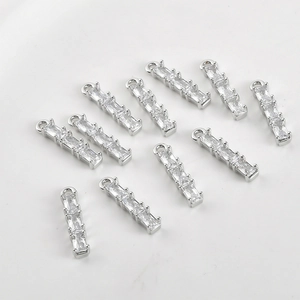 Close-up of 14k gold-plated bamboo pendants with cubic zirconia for DIY jewelry