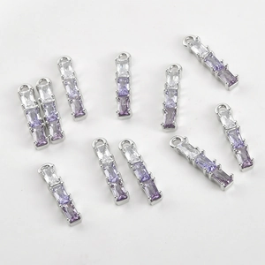 Macro shot of 10 rectangular gradient zirconia bamboo pendants for DIY jewelry making