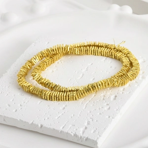 Textured gold square lava stone spacers for DIY jewelry making on white stone