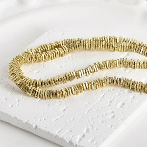 Detailed view of 4mm gold-plated volcanic stone spacer beads for DIY jewelry making