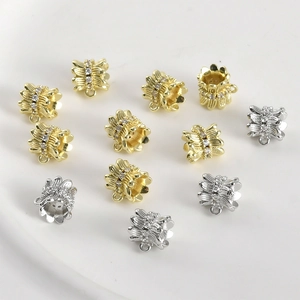 Detail of 14k gold plated flower spacer beads with zircon accents for DIY jewelry making