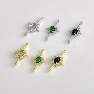 Detailed view of 14k gold plated starburst charms with zircon and colorful stones
