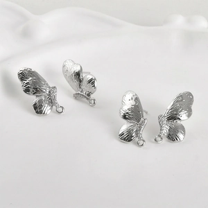 Détails de boucles d'oreilles papillon en argent avec zircons pour création DIY