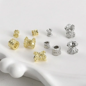 Selection of 14k gold plated spacer beads and lace floral charms for DIY jewelry making