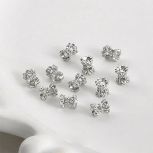 Macro view of 14k gold-plated lace hollow spacer beads for DIY jewelry making