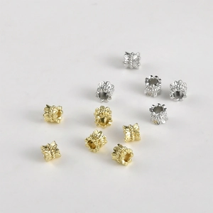 Macro detail of 14k gold plated lace spacer beads for DIY jewelry making
