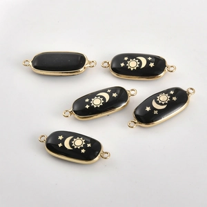 Oval celestial stone charms with sun and moon designs for DIY jewelry making