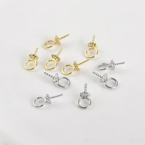 Macro detail of 14k gold-plated flower bead caps and pendants for jewelry DIY projects