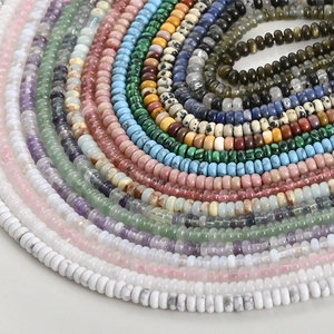 Macro shot of assorted colorful natural stone rondelle beads for DIY jewelry making