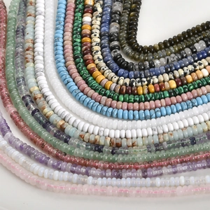 Colorful 2*6mm natural stone abacus beads arranged in a radial layout for DIY jewelry