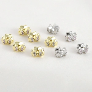 Bow and star spacer beads in gold and silver plating with pink and clear cubic zirconia