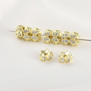 Close-up of 14k gold-plated bow beads with micro-pave cubic zirconia for DIY jewelry