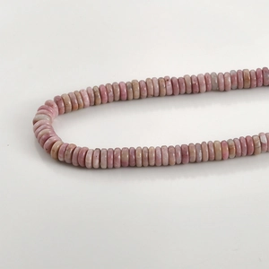 Macro view of multi-tonal pink natural crystal spacer beads for DIY jewelry making