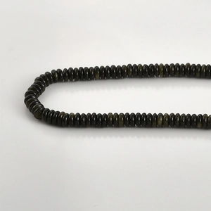 Macro detail of natural black jade abacus beads with polished oily luster for DIY jewelry