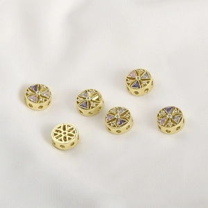 Close-up of 14k gold plated round spacers with colorful cubic zirconia for DIY jewelry