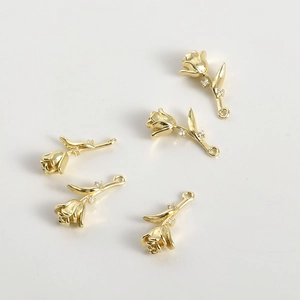 Detail of 14k gold plated tulip flower charms with white zircon for DIY jewelry making