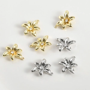 Detailed view of 14k gold plated lily flower pendants with cubic zirconia for DIY jewelry