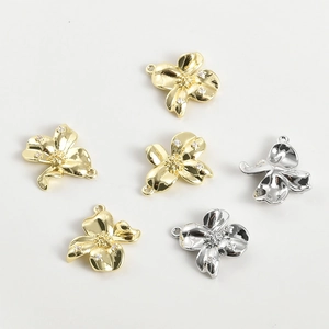 Macro view of 14k gold-plated flower pendants with sparkling zircon crystal stones