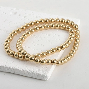 Macro detail of glossy gold plated hematite beads for DIY jewelry making sets