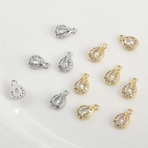 Detailed macro view of 14k gold plated pear-shaped zircon pendants for DIY jewelry