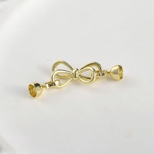 Detailed view of 14k gold plated bow clasp connector for DIY jewelry making