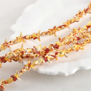 Starfish shaped synthetic turquoise beads in yellow with red spots for DIY jewelry making