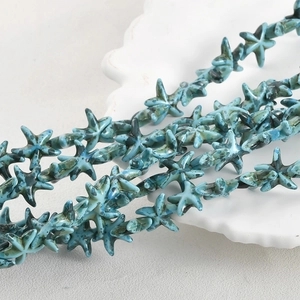 Detailed view of teal starfish synthetic turquoise beads for DIY jewelry crafting projects