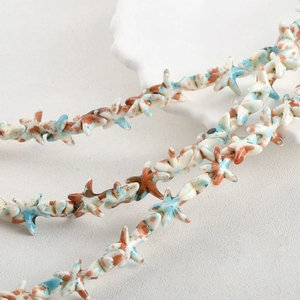Macro view of starfish-shaped turquoise beads with blue and brown vintage textures