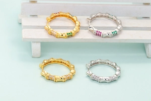 Bamboo shaped hoop earrings with colorful micro-pave zircons in gold and silver finish