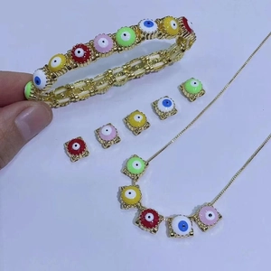 Bohemian colorful evil eye jewelry set with gold bracelets and enamel charms