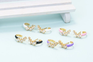 Detailed view of colorful enamel C-shape ear cuffs with micro-set zircon stones
