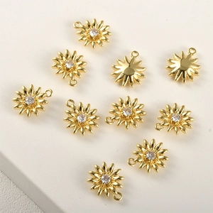 Detailed view of 14k gold-plated daisy charms with sparkling zircon centers and small rings