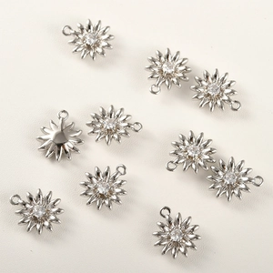 Close-up of 14k gold plated flower pendant with sparkling cubic zirconia for DIY jewelry