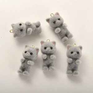 Detailed view of 5 gray flocked cat charms with gold rings for DIY jewelry making