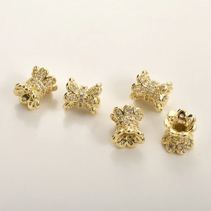Close-up of 14k gold plated copper spacer beads with zircons for jewelry making