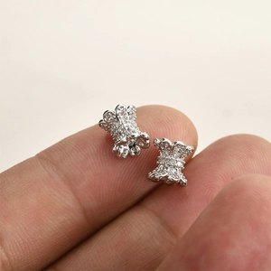 Macro shot of silver-plated waist-shaped beads with micro-pave white cubic zirconia stones