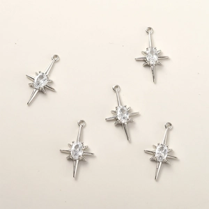 Detail of star-shaped 14k gold-plated pendants with cubic zirconia for DIY jewelry making